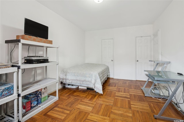 bedroom featuring parquet floors