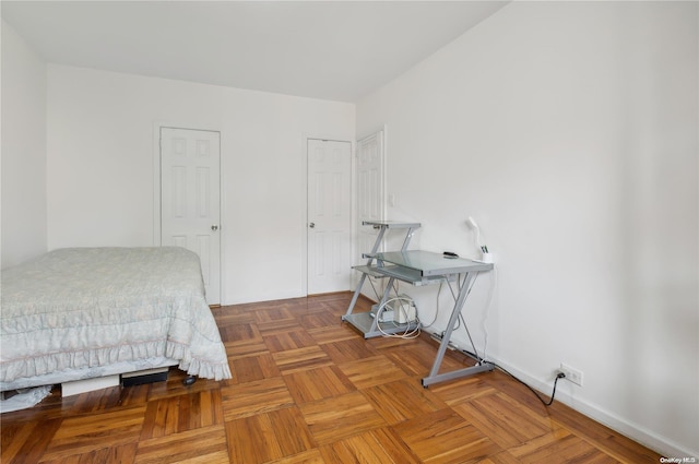 bedroom featuring parquet floors