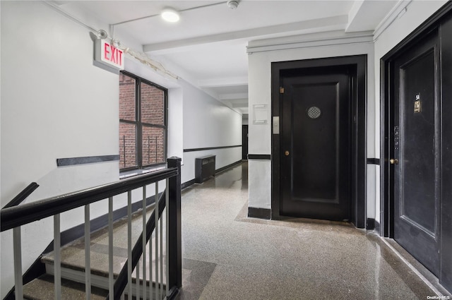 hallway with beamed ceiling