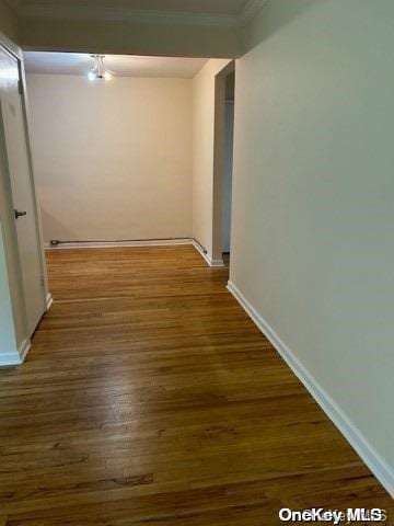 hall with dark hardwood / wood-style flooring and a notable chandelier