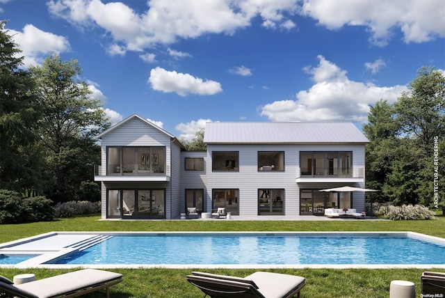 back of house with a patio area, an outbuilding, a yard, and a balcony