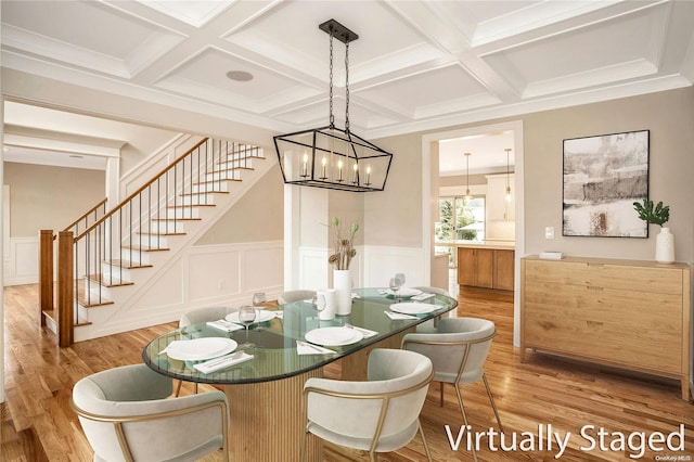 dining room with beamed ceiling, wood-type flooring, a chandelier, and coffered ceiling