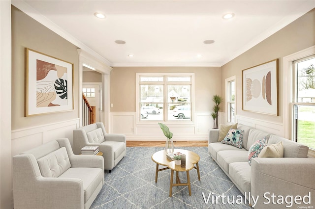 living room featuring a healthy amount of sunlight, dark hardwood / wood-style flooring, and crown molding