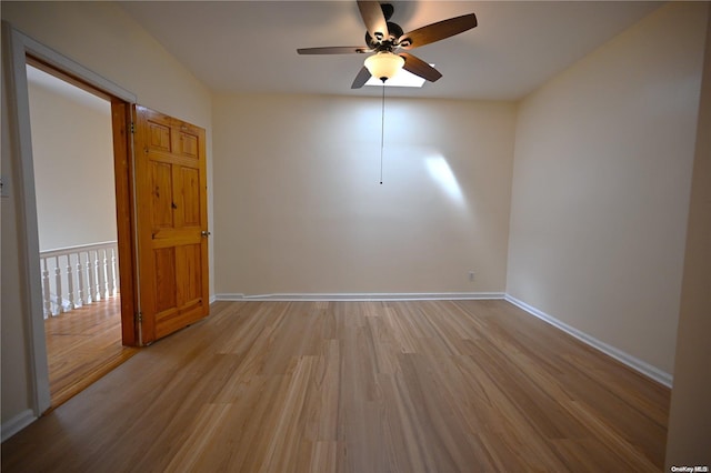 spare room with ceiling fan and light hardwood / wood-style flooring