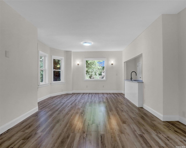 2 Oak Ct, Staten Island, NY 10308 - empty room with wood finished floors, a sink, and baseboards