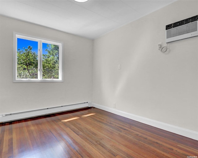 2 Oak Ct, Staten Island, NY 10308 - spare room with baseboard heating, an AC wall unit, wood finished floors, and baseboards