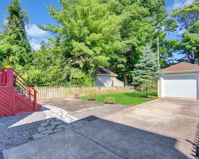 2 Oak Ct, Staten Island, NY 10308 - view of patio / terrace with concrete driveway, stairway, and a detached garage