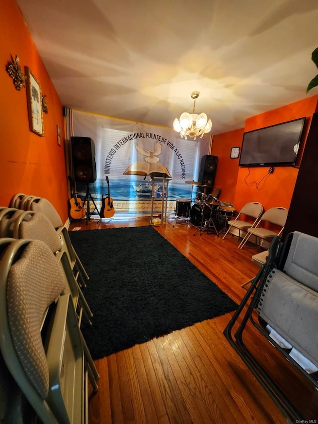 living room featuring hardwood / wood-style floors and a chandelier