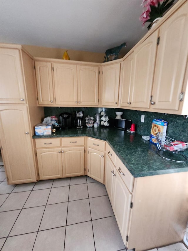 kitchen featuring decorative backsplash and light tile patterned floors