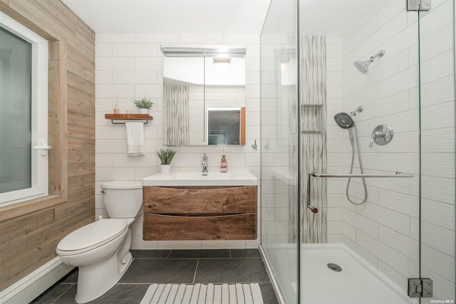 bathroom featuring a baseboard radiator, an enclosed shower, tile patterned floors, vanity, and toilet