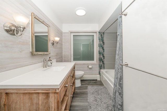 full bathroom featuring shower / bathing tub combination, hardwood / wood-style floors, toilet, and vanity