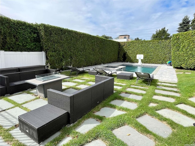 view of yard featuring a fenced in pool, an outdoor living space with a fire pit, and a patio area