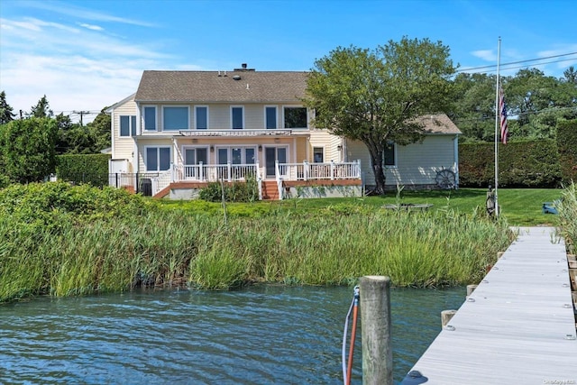 view of dock featuring a deck with water view