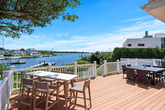 wooden deck featuring a water view