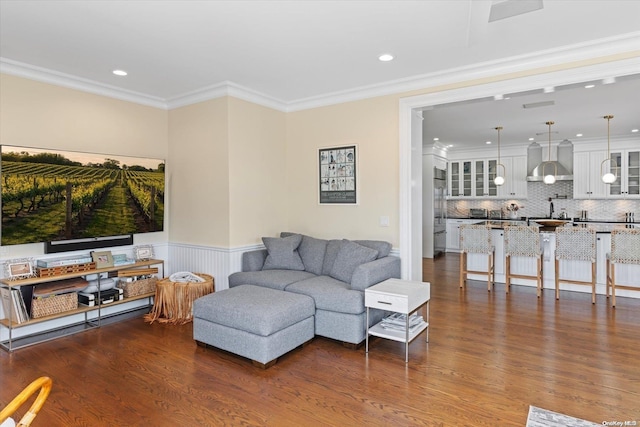 living room with crown molding and dark hardwood / wood-style floors