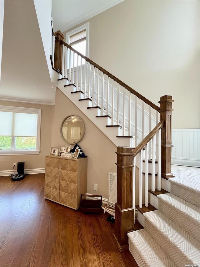 stairway with hardwood / wood-style floors