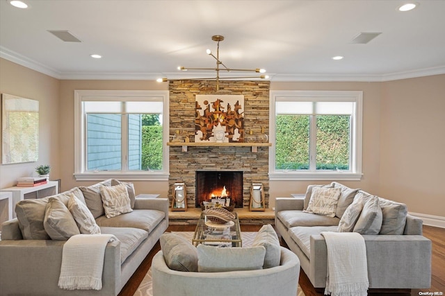 living room featuring a fireplace, dark hardwood / wood-style floors, and crown molding