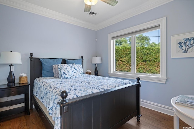 bedroom featuring dark hardwood / wood-style flooring, ceiling fan, and crown molding