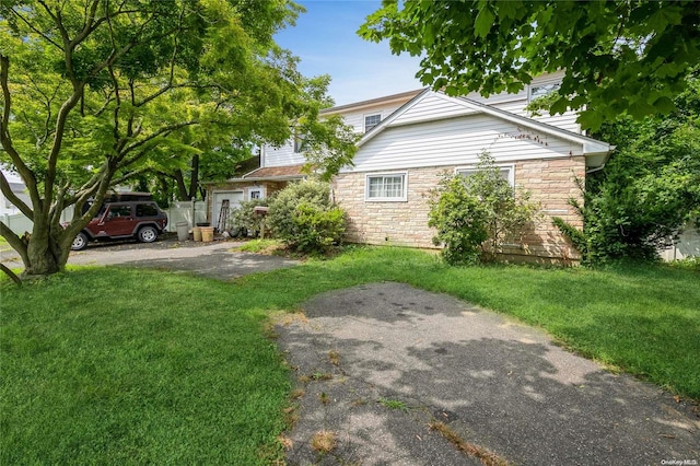 view of home's exterior featuring a yard