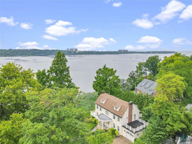 birds eye view of property with a water view