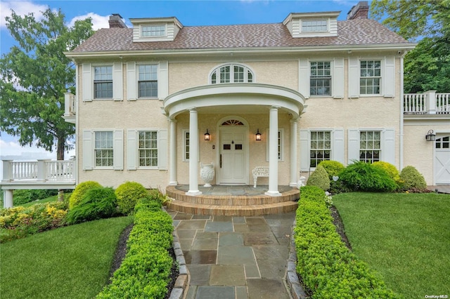 view of front of home with a front lawn