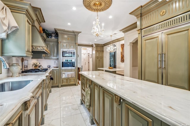 kitchen with an inviting chandelier, sink, crown molding, decorative light fixtures, and stainless steel appliances