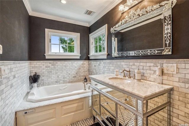 bathroom featuring a bathing tub, crown molding, and vanity