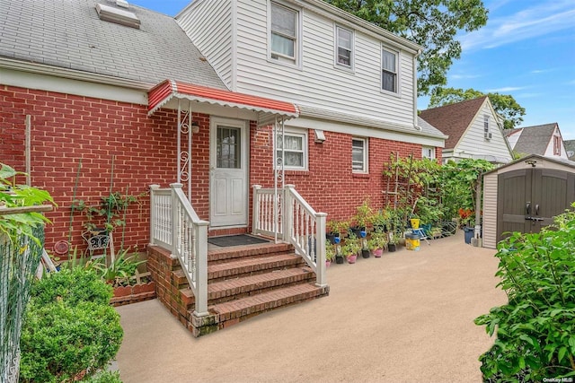 view of front of house with a storage shed