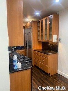 kitchen with dark hardwood / wood-style floors