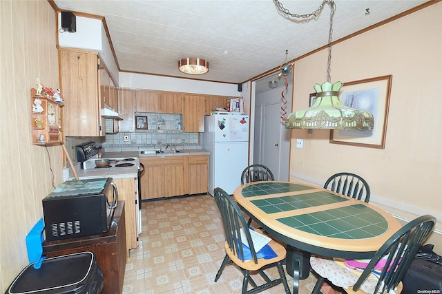 kitchen featuring decorative backsplash, range with electric cooktop, ornamental molding, decorative light fixtures, and white fridge