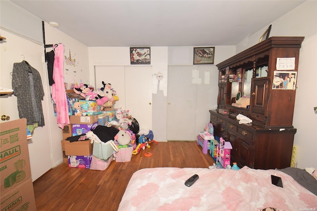 bedroom with wood-type flooring