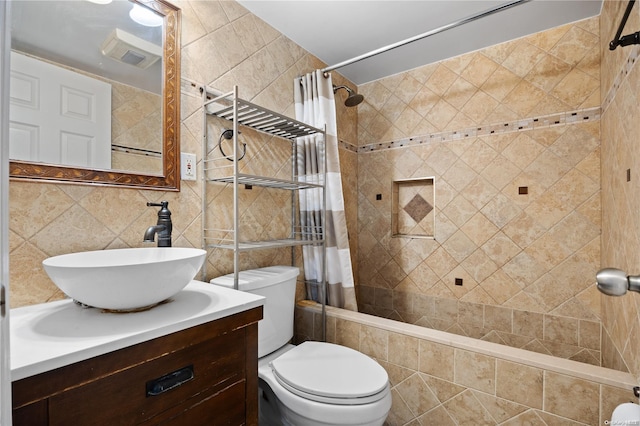 full bathroom featuring vanity, shower / bathtub combination with curtain, toilet, and tile walls