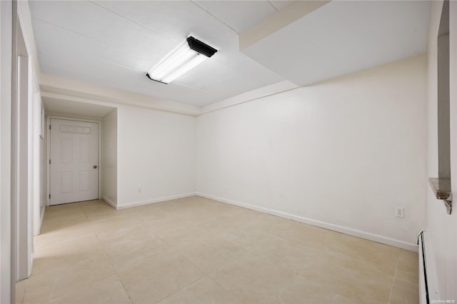 unfurnished room featuring a baseboard radiator