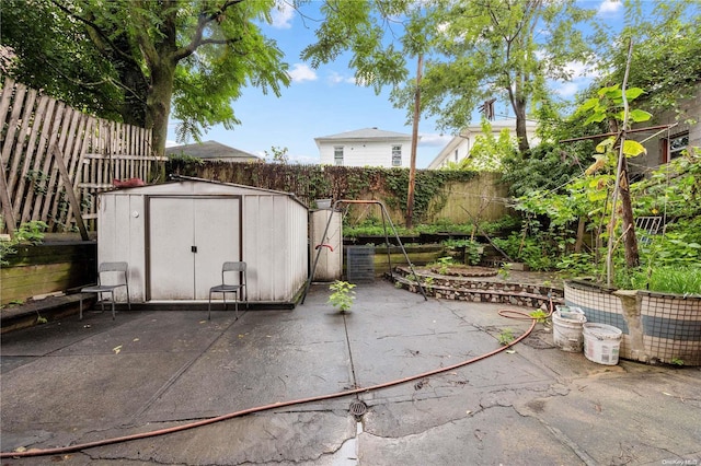 view of patio / terrace with a storage unit