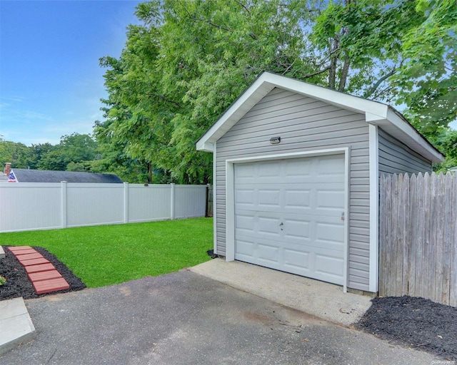 garage with a lawn