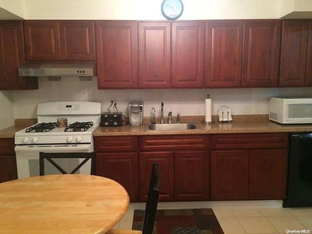 kitchen with light tile patterned floors, white appliances, and sink