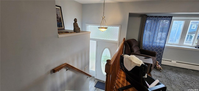 foyer entrance featuring baseboard heating