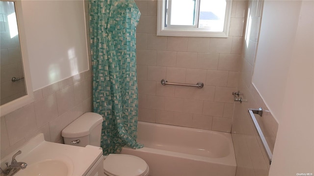 full bathroom featuring vanity, toilet, tile walls, and shower / bath combo with shower curtain