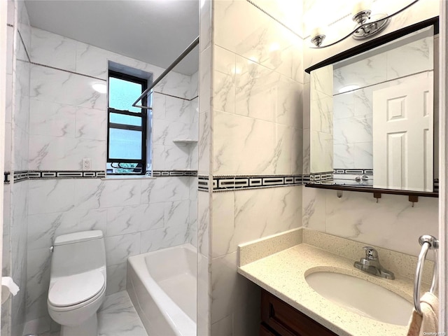 full bathroom featuring toilet, vanity, tile walls, and tiled shower / bath