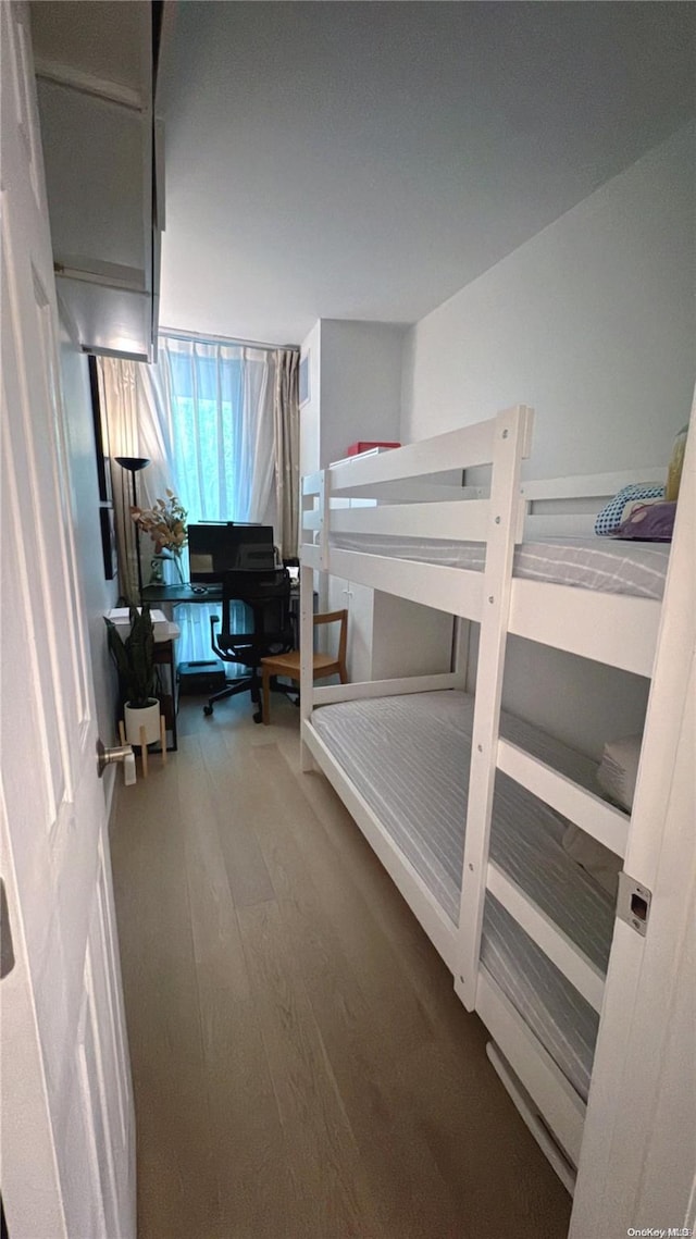 bedroom with wood-type flooring