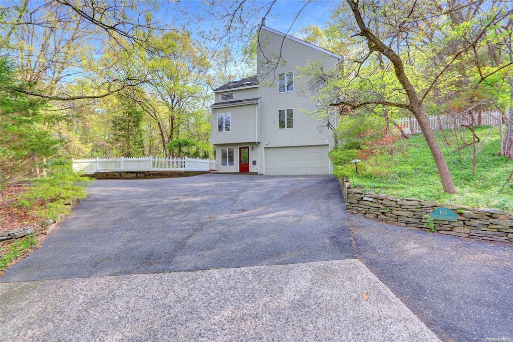 view of property exterior with a garage