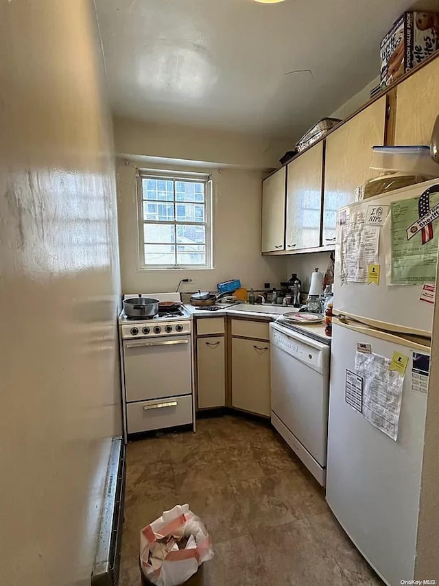 kitchen featuring sink and white appliances