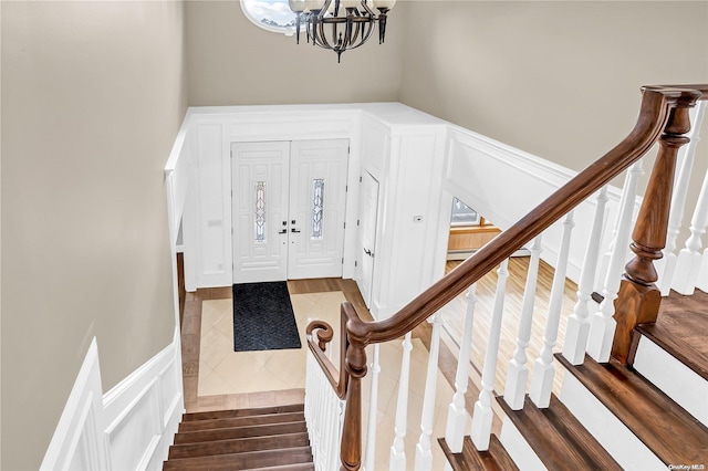 foyer featuring dark hardwood / wood-style flooring and a chandelier