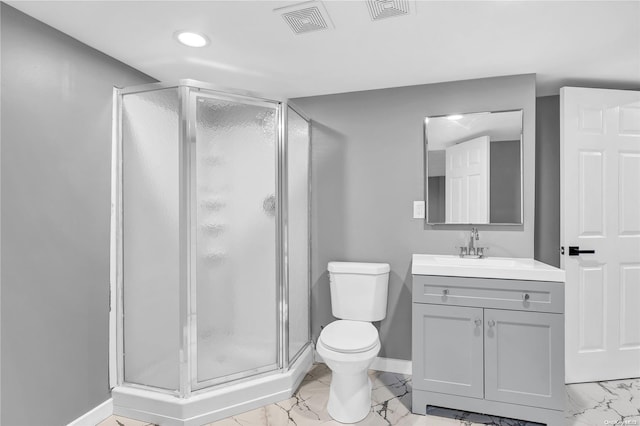 bathroom featuring vanity, toilet, and walk in shower