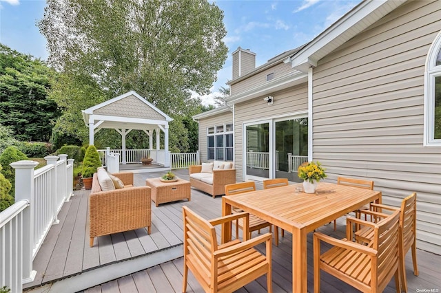 wooden deck with a gazebo and outdoor lounge area