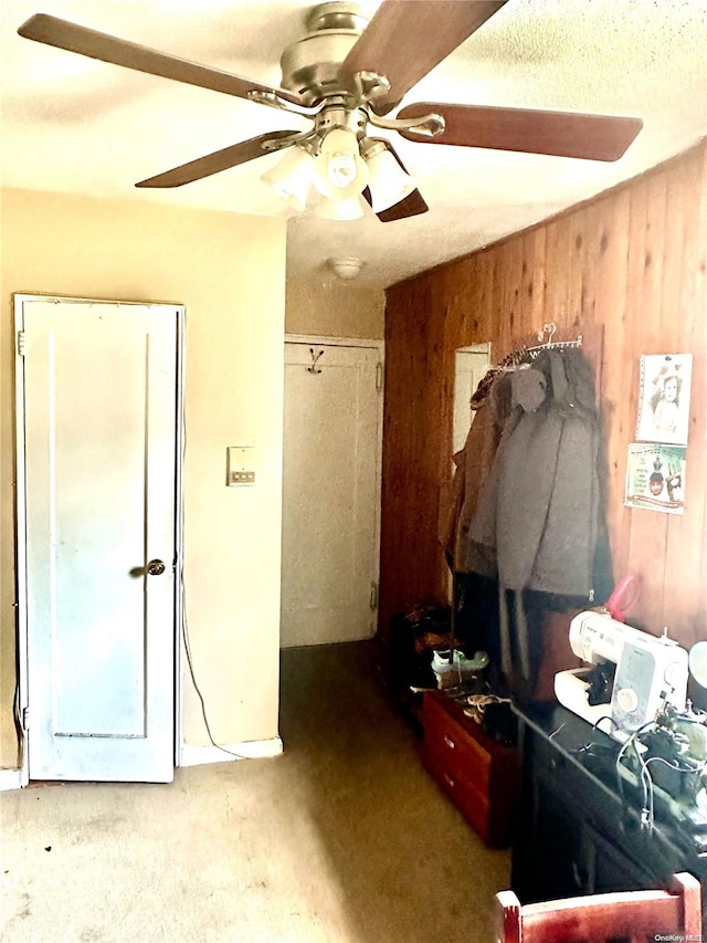 interior space with wooden walls and carpet