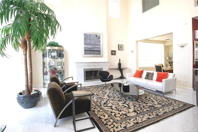 living room featuring a towering ceiling