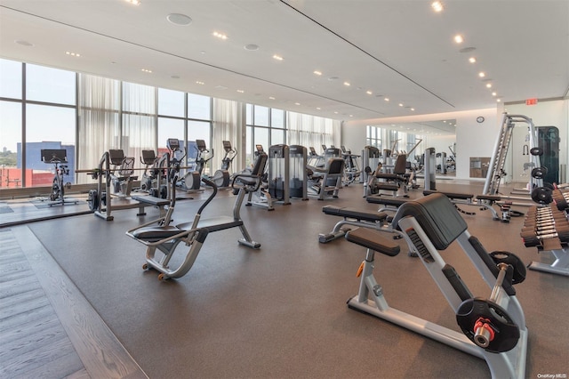 exercise room featuring floor to ceiling windows