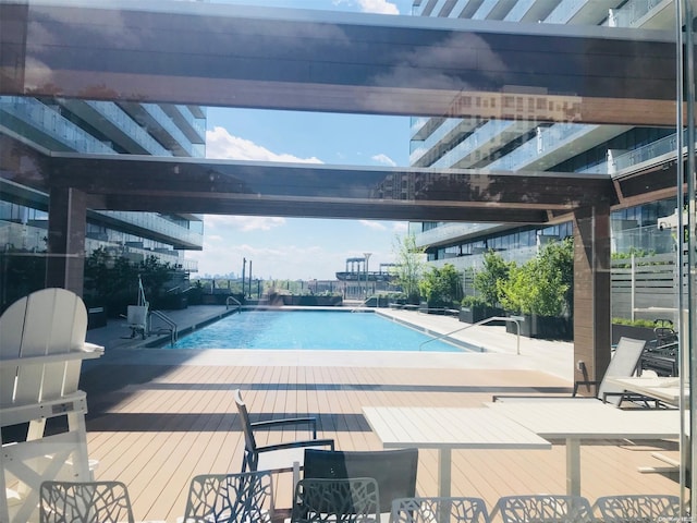 view of pool featuring a wooden deck