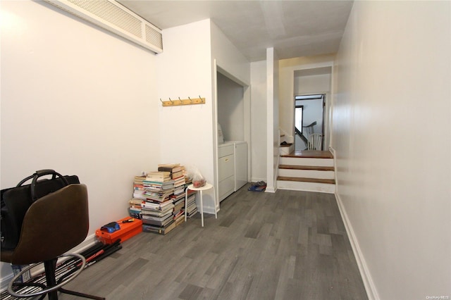 hallway featuring washing machine and dryer and dark wood-type flooring